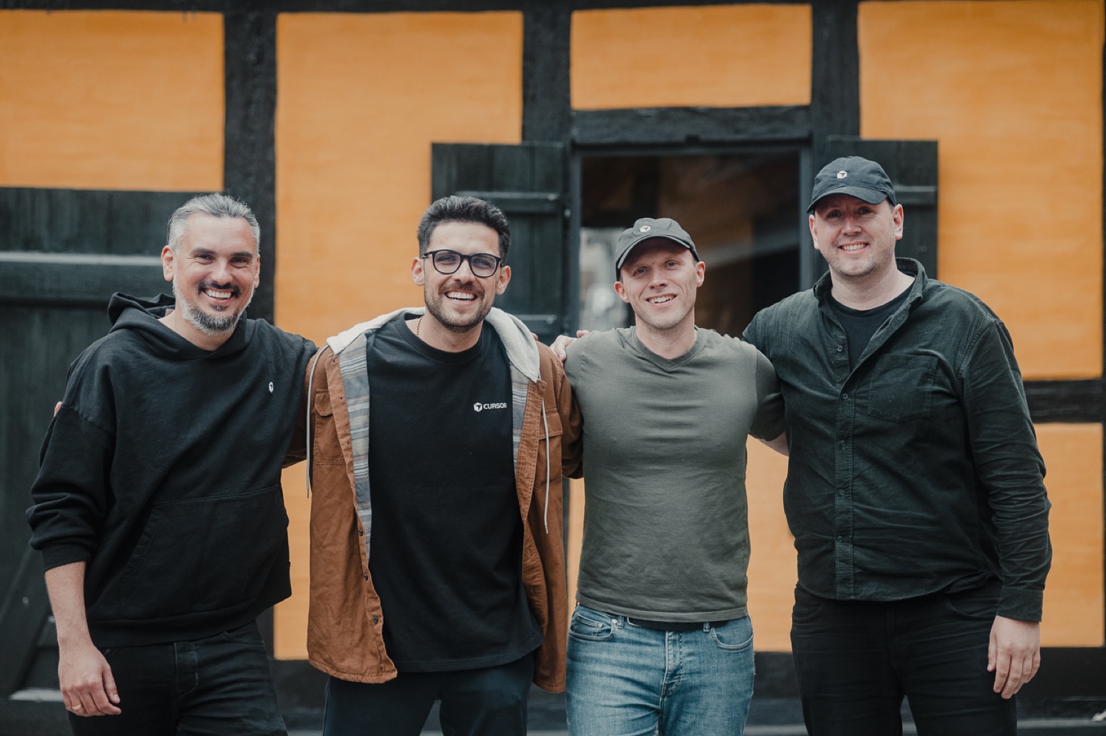 Organizers posing together outside the venue